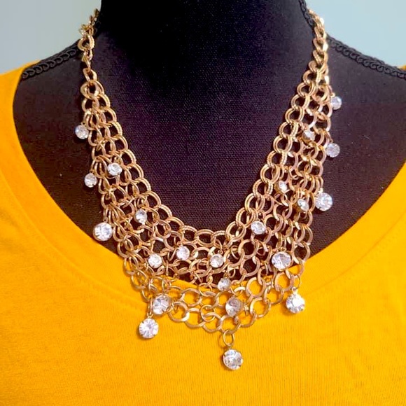 Net style necklace, with complementary earrings.